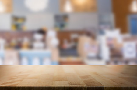 Selected focus empty brown wooden table and space of Coffee shop blur background with bokeh image,...