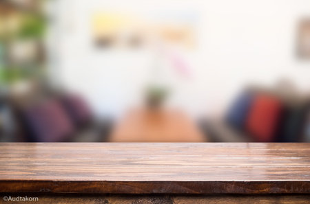 Selected focus empty brown wooden table and Coffee shop blur background with bokeh image, for...