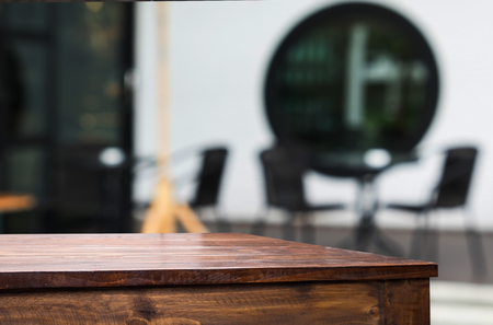 Selected focus empty brown wooden table and Coffee shop blur background with bokeh image, for product display montageの写真素材