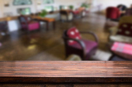 Selected focus empty brown wooden table and Coffee shop blur background with bokeh image. for your photomontage or product display.の写真素材