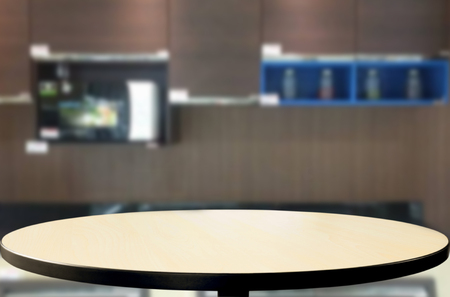 Dining table on blurred brown kitchen interior background.の写真素材