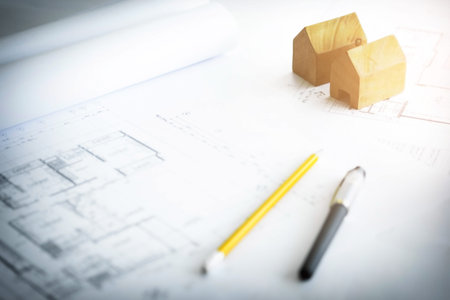 Construction equipment. Repair work. Drawings for building Architectural project, blueprint rolls and divider compass on table. Engineering tools concept. Copy space.の写真素材