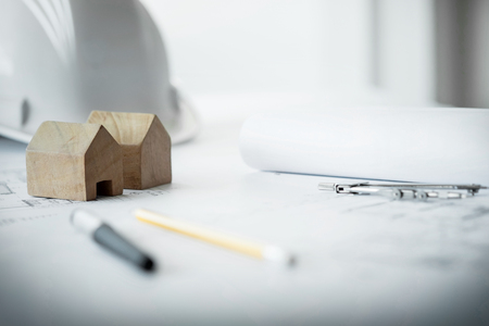 Construction equipment. Repair work. Drawings for building Architectural project, blueprint rolls and divider compass on table. Engineering tools concept. Copy space.の写真素材