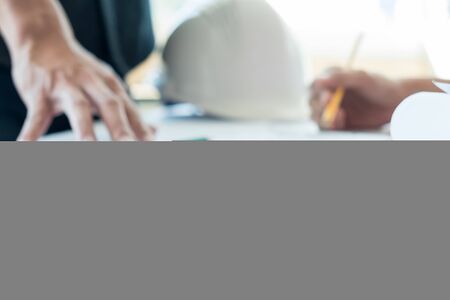 Team of architects people in group on construciton site check documents and business workflow.の写真素材