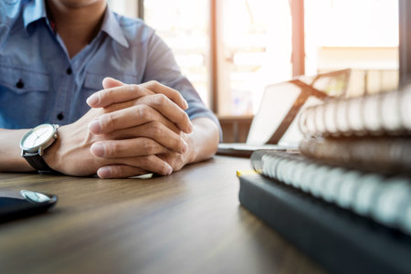 Formally dressed business people planning work in office.の写真素材