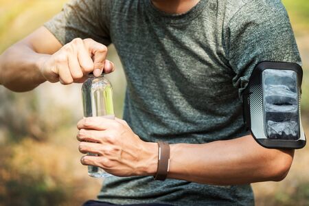 Sport man drinking water bottle.の写真素材