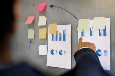 Business man speaker giving a talk finance profit graph presentation meeting audience in the conference modern office at board brainstorming meeting working concept.の写真素材