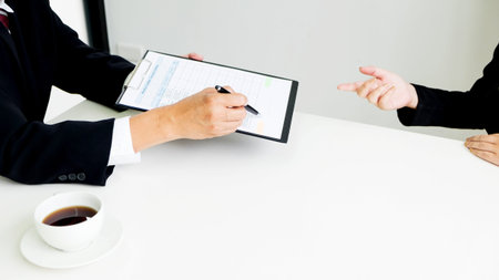 Business concept - Executives at desk discussion sales performance in a office.の写真素材