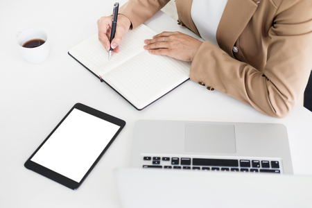 Hands of financial business women manager taking notes when working on reportの写真素材