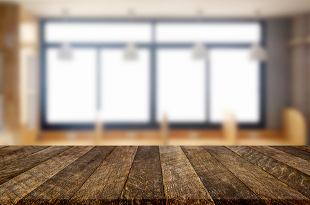 Empty of wood table top on blur of window glass in the morning background. for your photomontage or product displayの写真素材