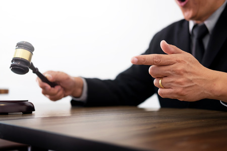  judge wags his finger as he lays down the law.の写真素材