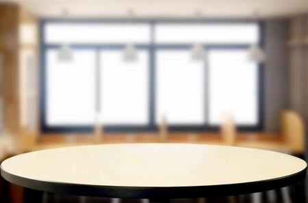 Empty of wood table top on blur of window glass in the morning background. for your photomontage or product displayの写真素材