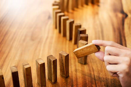 Place a wooden block lines Business man solving a problem.の写真素材