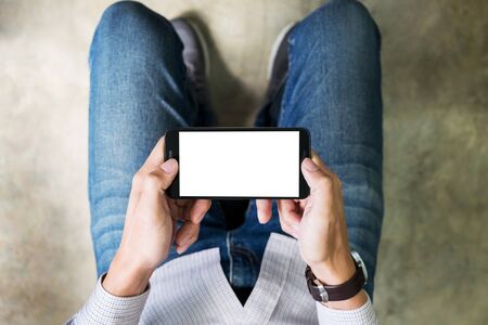 Closeup of Teenager Playing videogames On Mobile phoneの写真素材