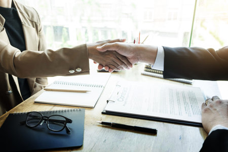 Successful job interview with boss and employee handshaking after good deal, Congratulation, merger...