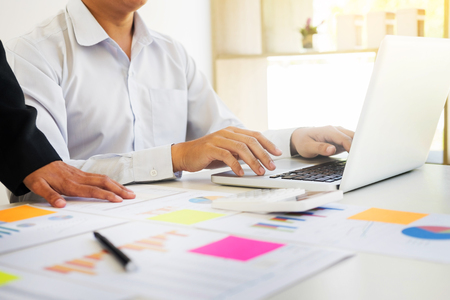 Administrator business man financial inspector and secretary making report, calculating balance. Internal Revenue Service checking document. Audit conceptの写真素材