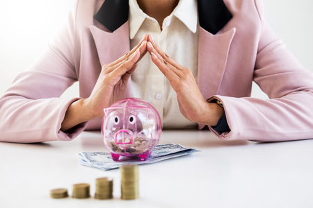 business man counting money at the table, accounting conceptの写真素材