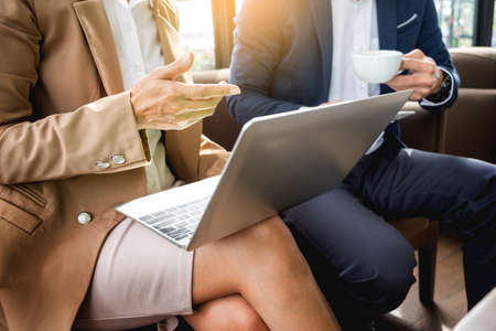 meeting in workplace concept, business people working with document, tablet and laptop computer.の写真素材