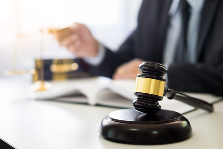 gavel and soundblock of justice law and lawyer working on wooden desk backgroundの写真素材
