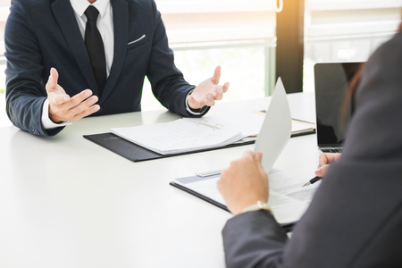young man explaining about his profile to business managers sitting in job Interview.の写真素材