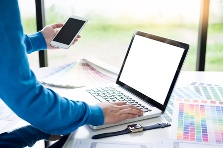 interior design or graphic designer renovation and technology concept - woman working with colour samples for selection. at workplace choosing colour swatches, closeup. Creative peopleの写真素材