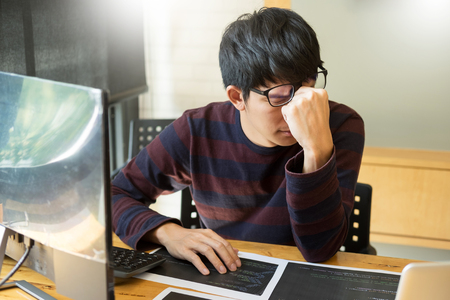 Young modern stressed programmer businessman a brake from working with laptop computer, Problem solving.の写真素材