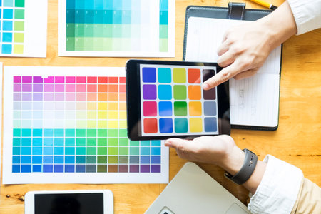 Professional Creative architect graphic desiner occupation choosing the Color pantone  palette...