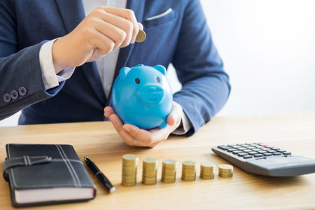 Business accounting man hands working stacking coin the calculator, calculating, financial...