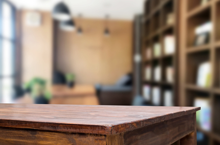 Wooden board empty Table Top And Blur Interior over blur in coffee shop Background, Mock up for display of product.の写真素材