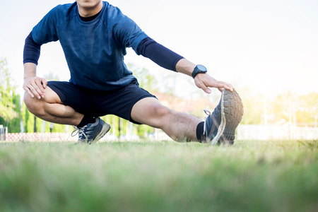Portrait of fatigued young fit athletic man Muscular for health and strong guy exercising in sportswear outdoors.の写真素材
