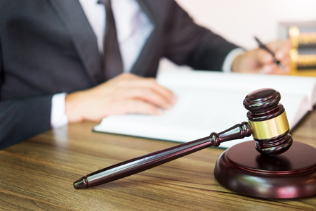 gavel and soundblock of justice law and lawyer working on wooden desk backgroundの写真素材