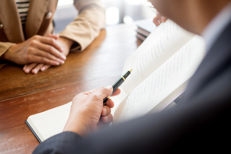 lawyer in office. Counseling and giving advice about legal legislation in courtroom to help customer, tribunal and justice concept.の写真素材