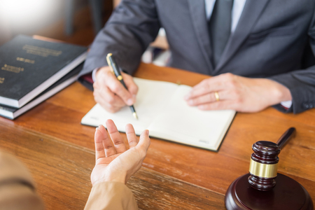 lawyer in office. Counseling and giving advice about legal legislation in courtroom to help customer, tribunal and justice concept.の写真素材