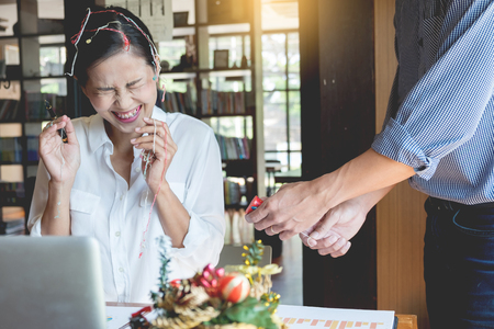 successful Business people wearing Santa hat  celebrating 2019 New Year Christmas presents at office party, having great timeの写真素材
