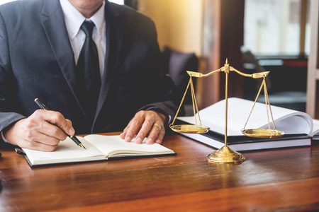 The private office workplace for consultant an young lawyer legislation with gavel and document on wood tableの写真素材