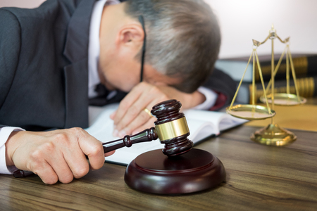 lawyer tried or stress from hard workingの写真素材