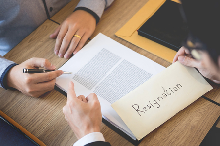businessman hand sending a resignation letter to executive boss dismissed worker quit out from company, Change job, unemployment, resign concept.の写真素材