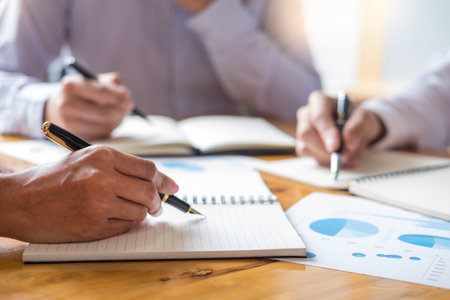 Business team data analyzing income charts document during discussion explain strategy meeting. on...
