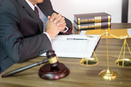 gavel and soundblock of justice law and lawyer working on wooden desk backgroundの写真素材