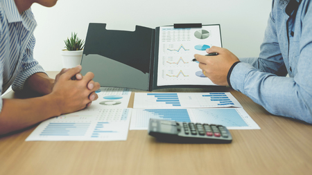 Startup Teamwork Brainstorming Meeting with Graph Planning strategy and financial plan to investmentの写真素材