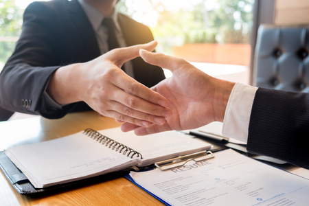 Business, career and placement concept, boss and employee handshaking after successful negotiations or interviewの写真素材
