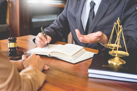 lawyer in office. Counseling and giving advice about legal legislation in courtroom to help customer, tribunal and justice concept.の写真素材