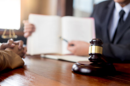 lawyer in office. Counseling and giving advice about legal legislation in courtroom to help...