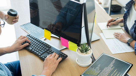 IT office Programmers software development coding technologies On Computer working in a company office.の写真素材
