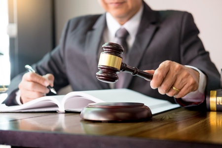 gavel and soundblock of justice law and lawyer working on wooden desk backgroundの写真素材