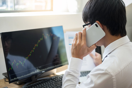 Broker working trading do this deal gesturing on a stock market exchange on laptop Management customer Account Conceptの写真素材