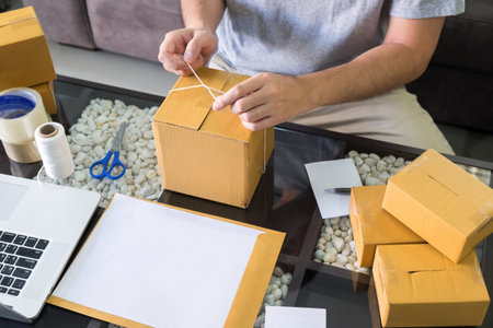 prepare online shopping parcel Shopping concept, Young start up small business owner packaging...
