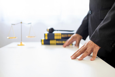 gavel and sound block of justice law and lawyer working on wooden desk backgroundの写真素材