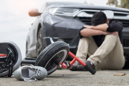 scared and stressed desperate drunken driver and bottle of beer in front of automobile crash car...