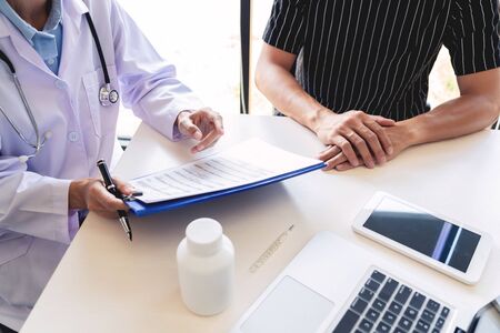 healthcare and medical ethics concept, doctor explains prescription to victim diagnosis  giving a consultation and Patient listening intently in hospitalの写真素材